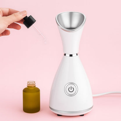 Facial steamer nozzle close-up showing mist outlet