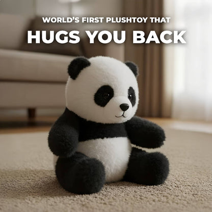 Panda-shaped plush toy with text 'World's First PlushToy That Hugs You Back' on a blurred indoor background
